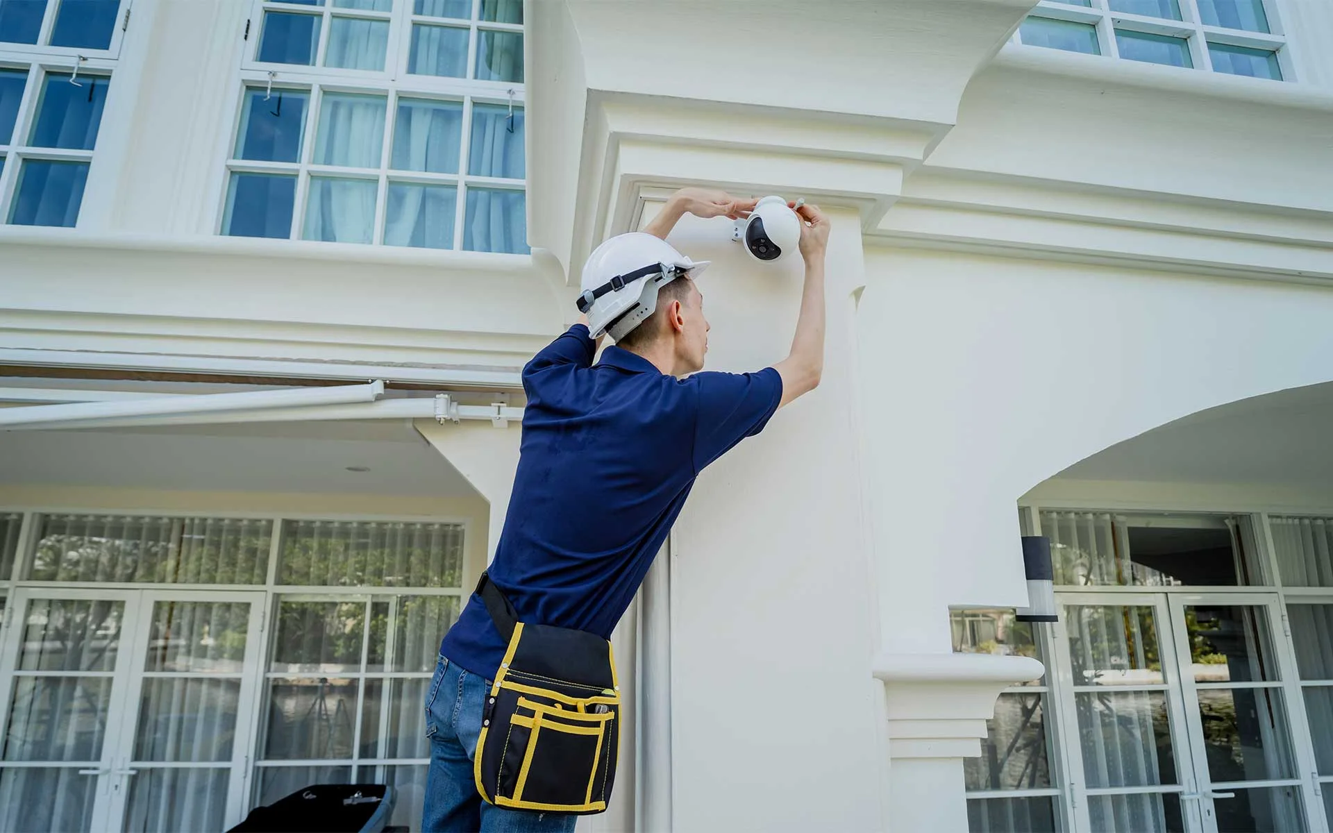 Security technician installing a PTZ camera
