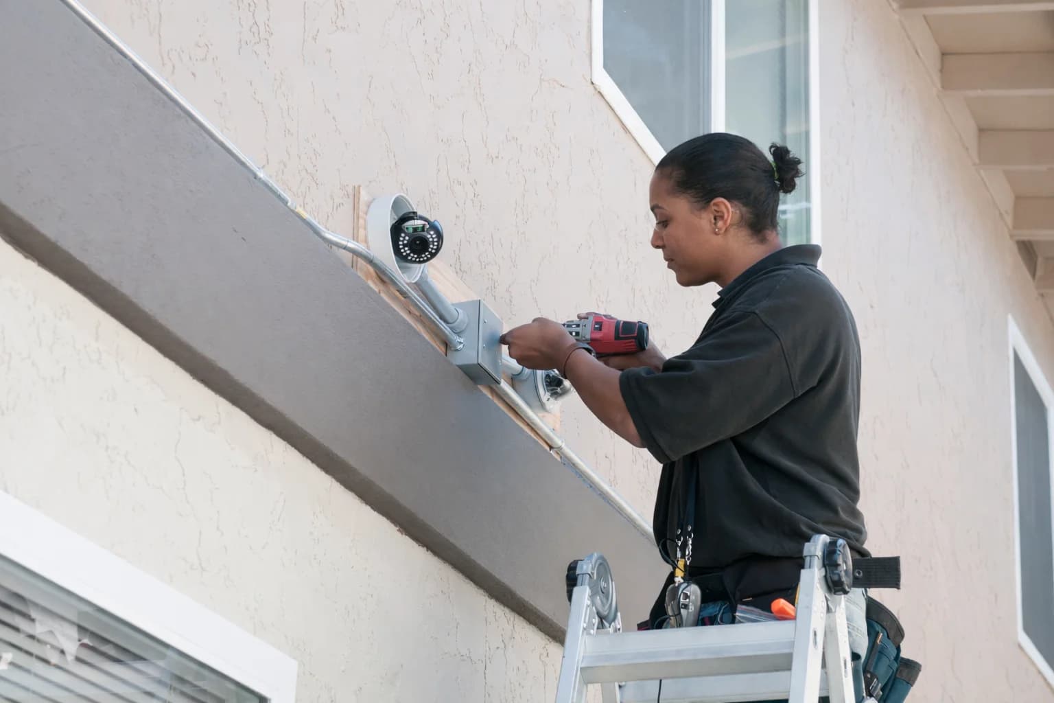 Security technician installing a camera system